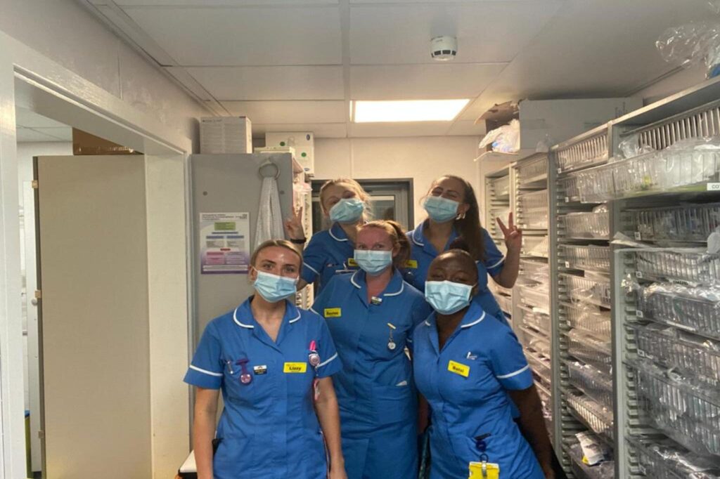 nhs nurses posing for a photo in a hospital
