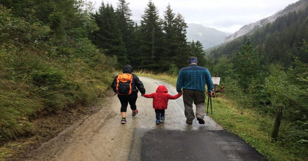 Family walking in the UK countryside after relocating