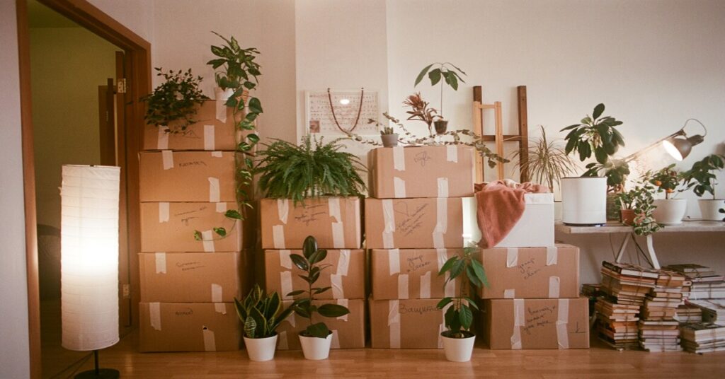 Cardboard shipping boxes packed for a move to the UK